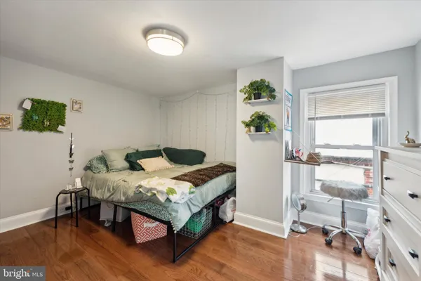 a bed room with a bed and a window