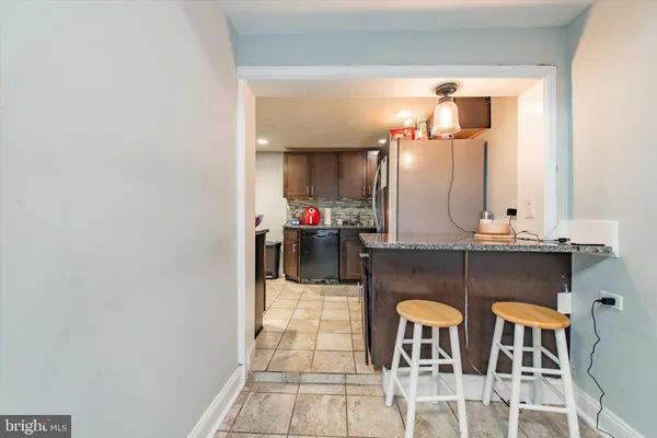 a dining room with furniture and a mirror
