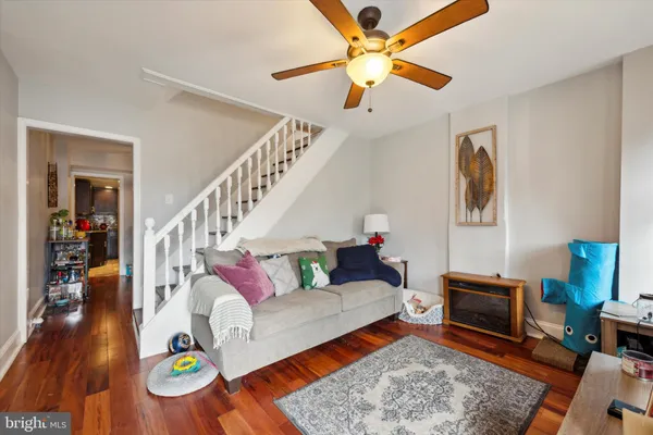 a living room with furniture and a rug