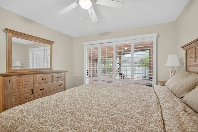 a spacious bedroom with a large bed and a window