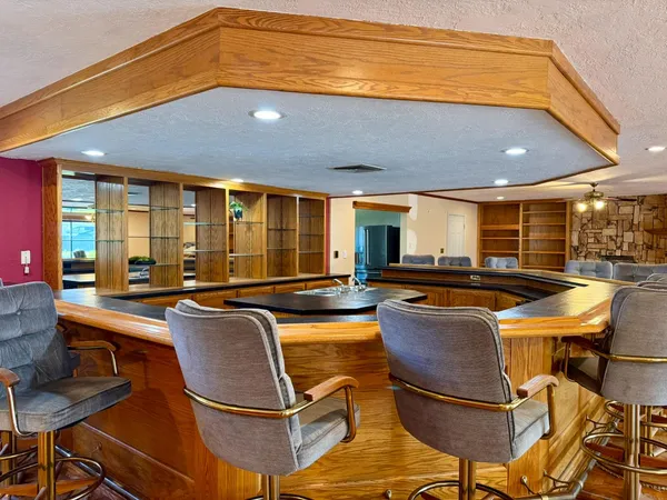 a room with table tennis pool table and chairs