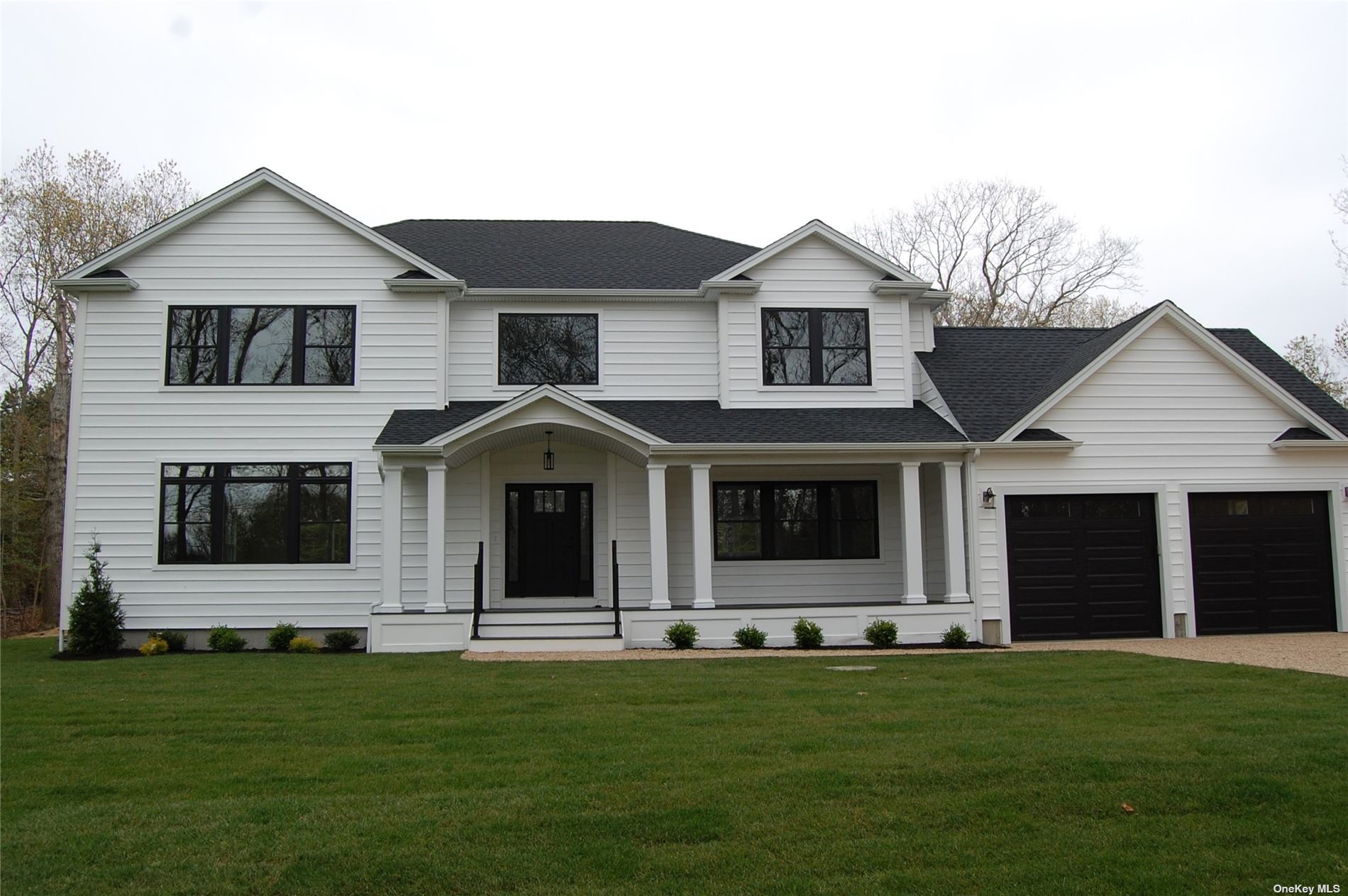 47A Old Country Road Westhampton, NY 11977 - Photo 1 of 1 a front view of a house with a yard