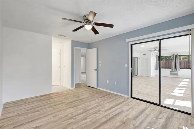 a bathroom with a double vanity sink a mirror and a toilet