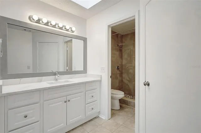 a bathroom with a shower and a toilet