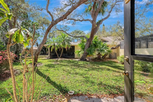 a front view of a house with a yard table and chairs