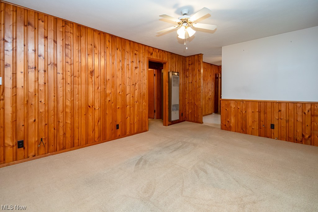 5 Pleasantview Vermilion, OH 44089 - Photo 4 of 37 Carpeted spare room featuring ceiling fan