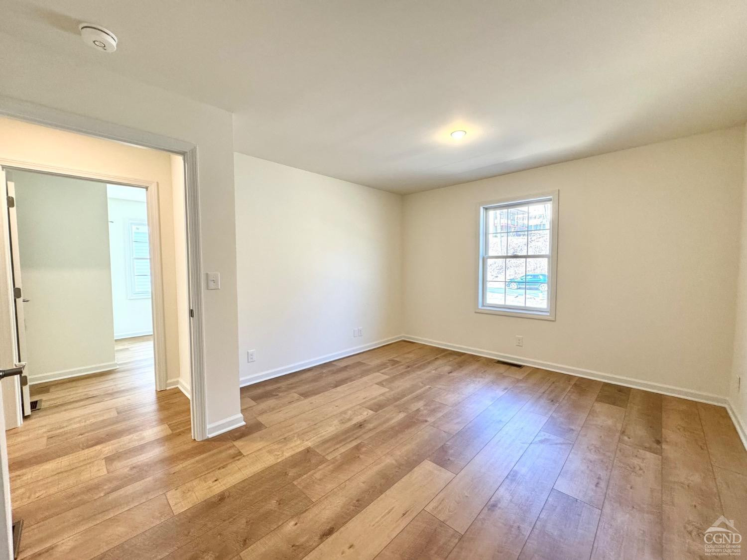 34 Marina Drive Catskill, NY 12414 - Photo 18 of 28 an empty room with wooden floor and windows
