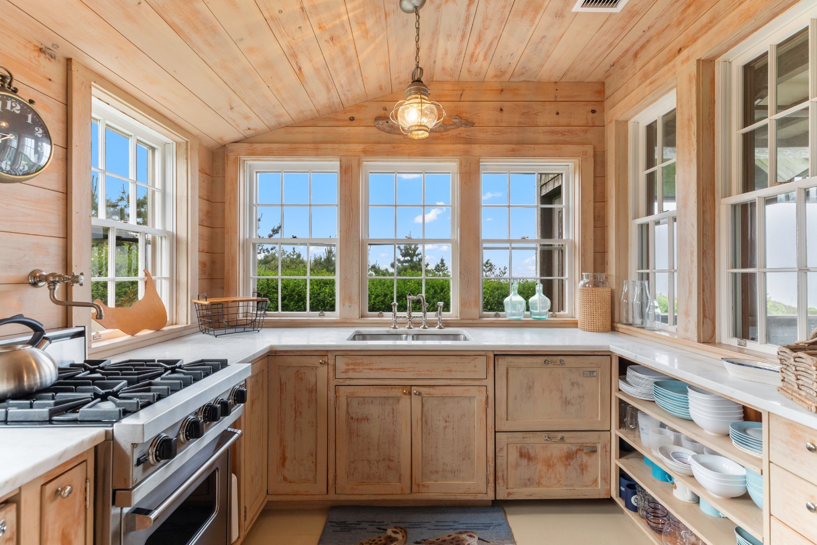 3 North Gully Road Nantucket, MA 02554 - Photo 12 of 43 a kitchen with stainless steel appliances granite countertop a stove and a large window