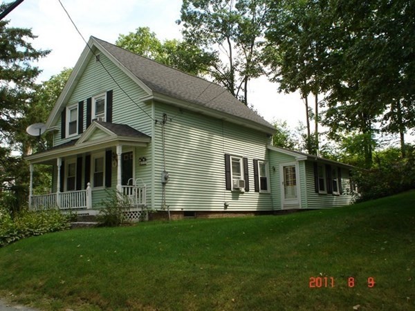 33 Center Road Shirley, MA 01464 - Photo 2 of 7 a front view of house with yard and green space
