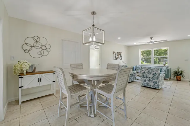 a dining room with furniture and window