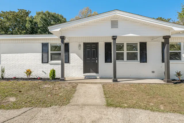a front view of a house with garage