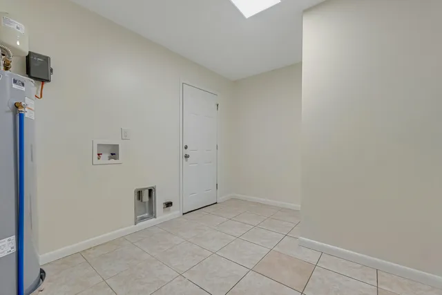 a view of a hallway with wooden shelves