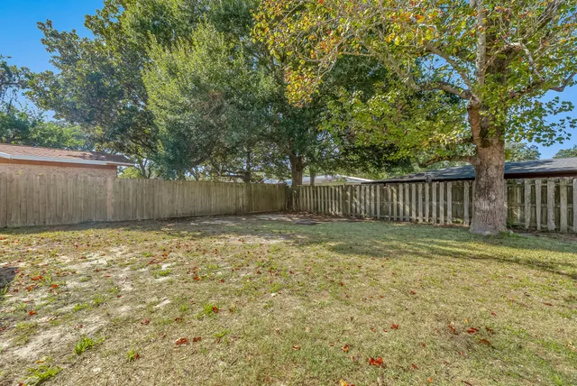 a view of house with outdoor space and garden