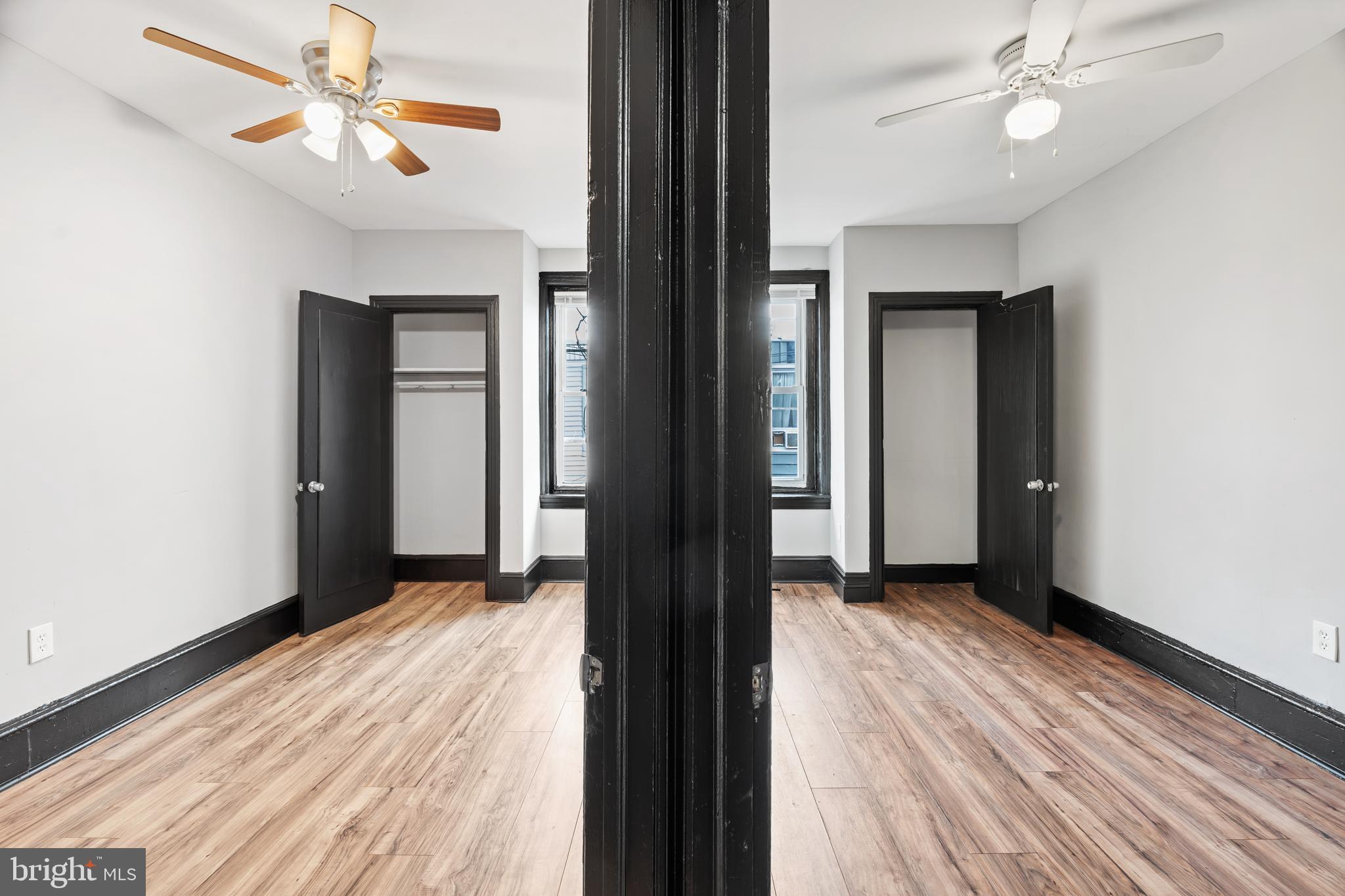 3239 North 26th Street Philadelphia, PA 19129 - Photo 14 of 28 wooden floor in an empty room with a window