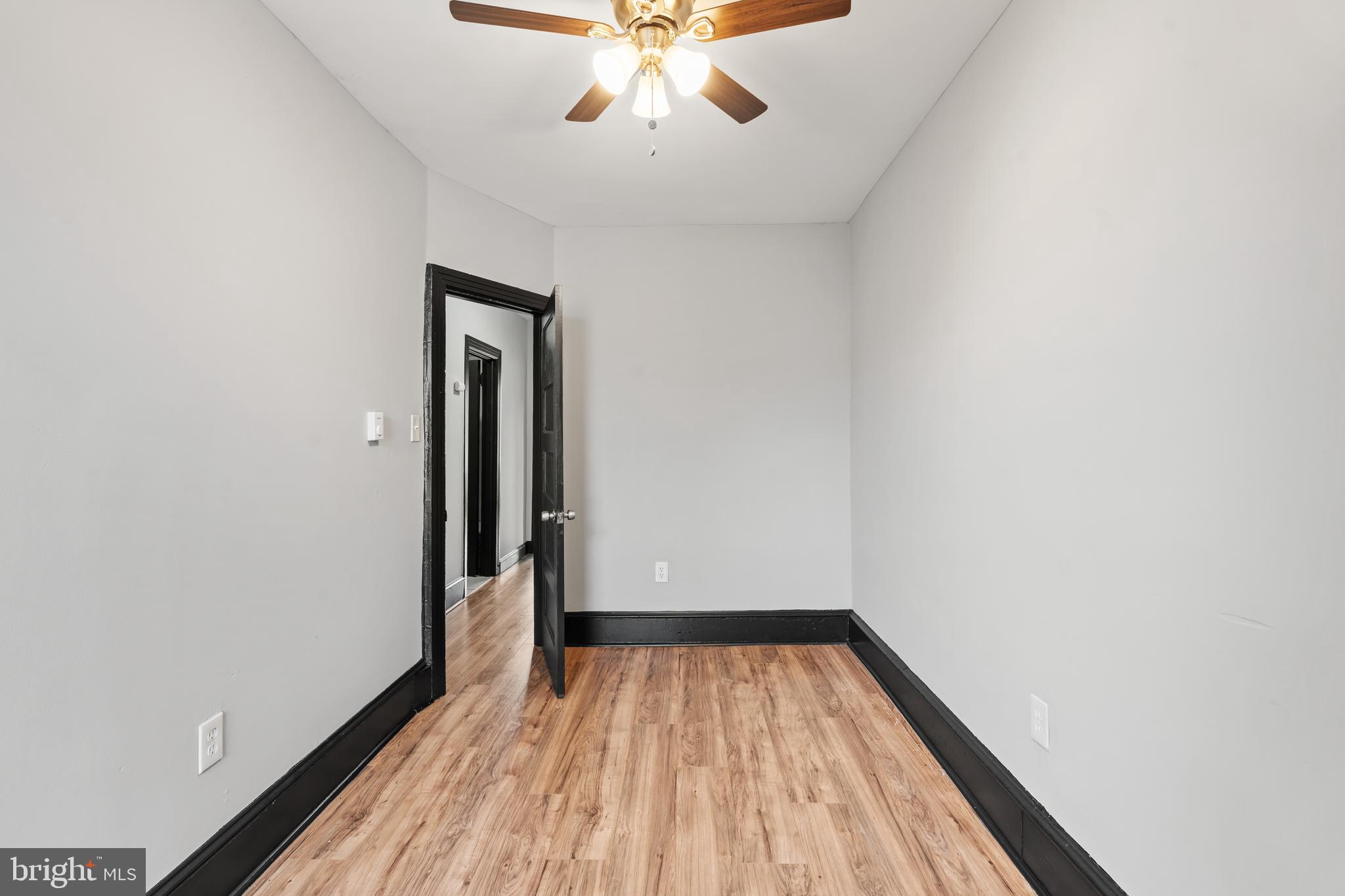 3239 North 26th Street Philadelphia, PA 19129 - Photo 16 of 28 wooden floor in an empty room with a window