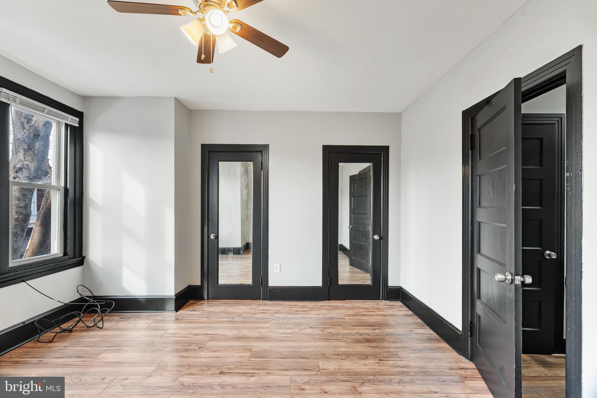3239 North 26th Street Philadelphia, PA 19129 - Photo 24 of 28 a view of an empty room with wooden floor and a window