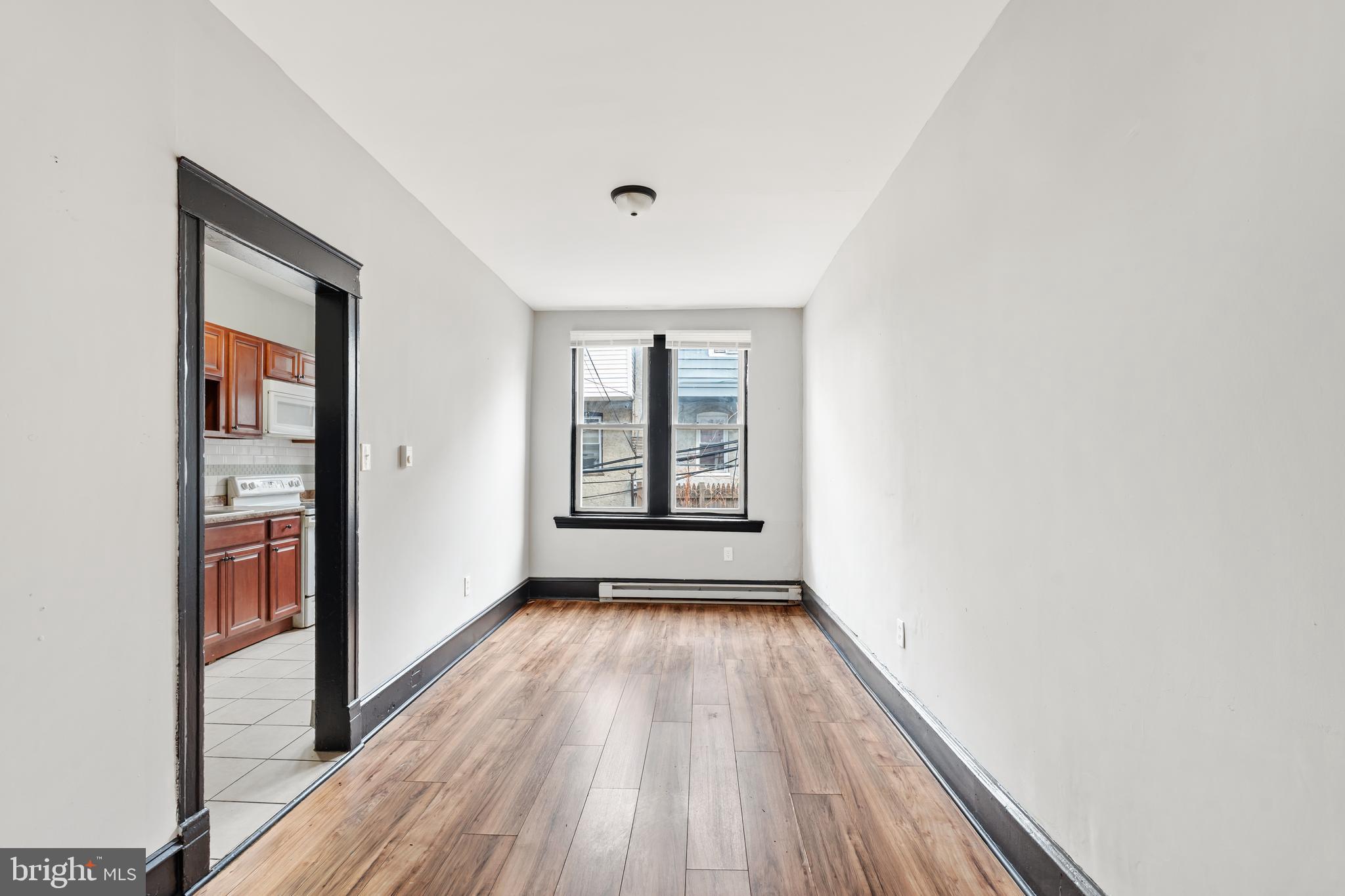 3239 North 26th Street Philadelphia, PA 19129 - Photo 7 of 28 a view of a room with wooden floor and window