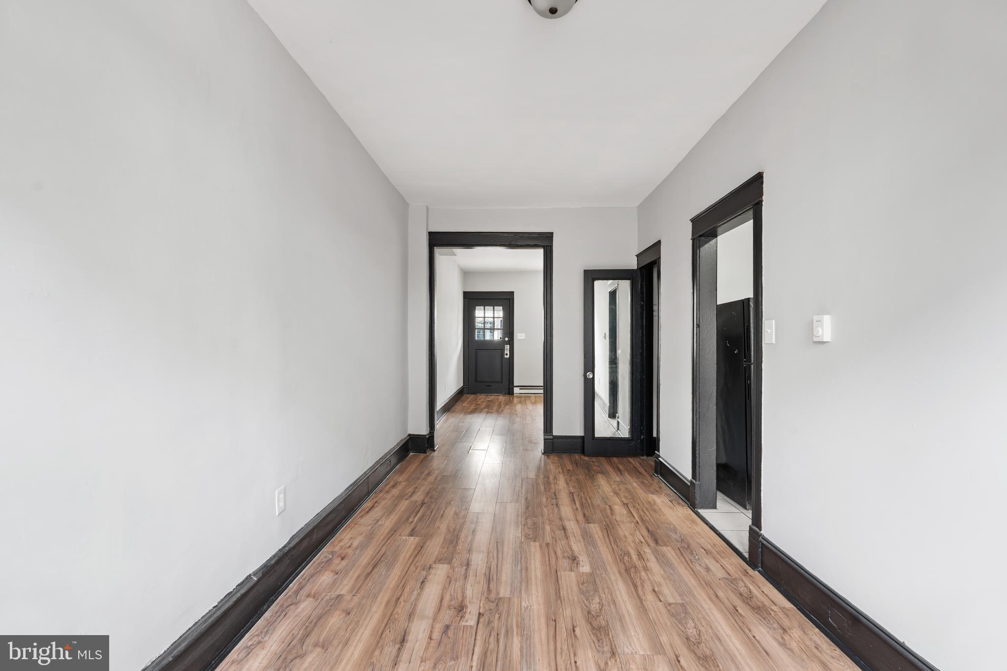 3239 North 26th Street Philadelphia, PA 19129 - Photo 8 of 28 a view of a room with wooden floor and gate