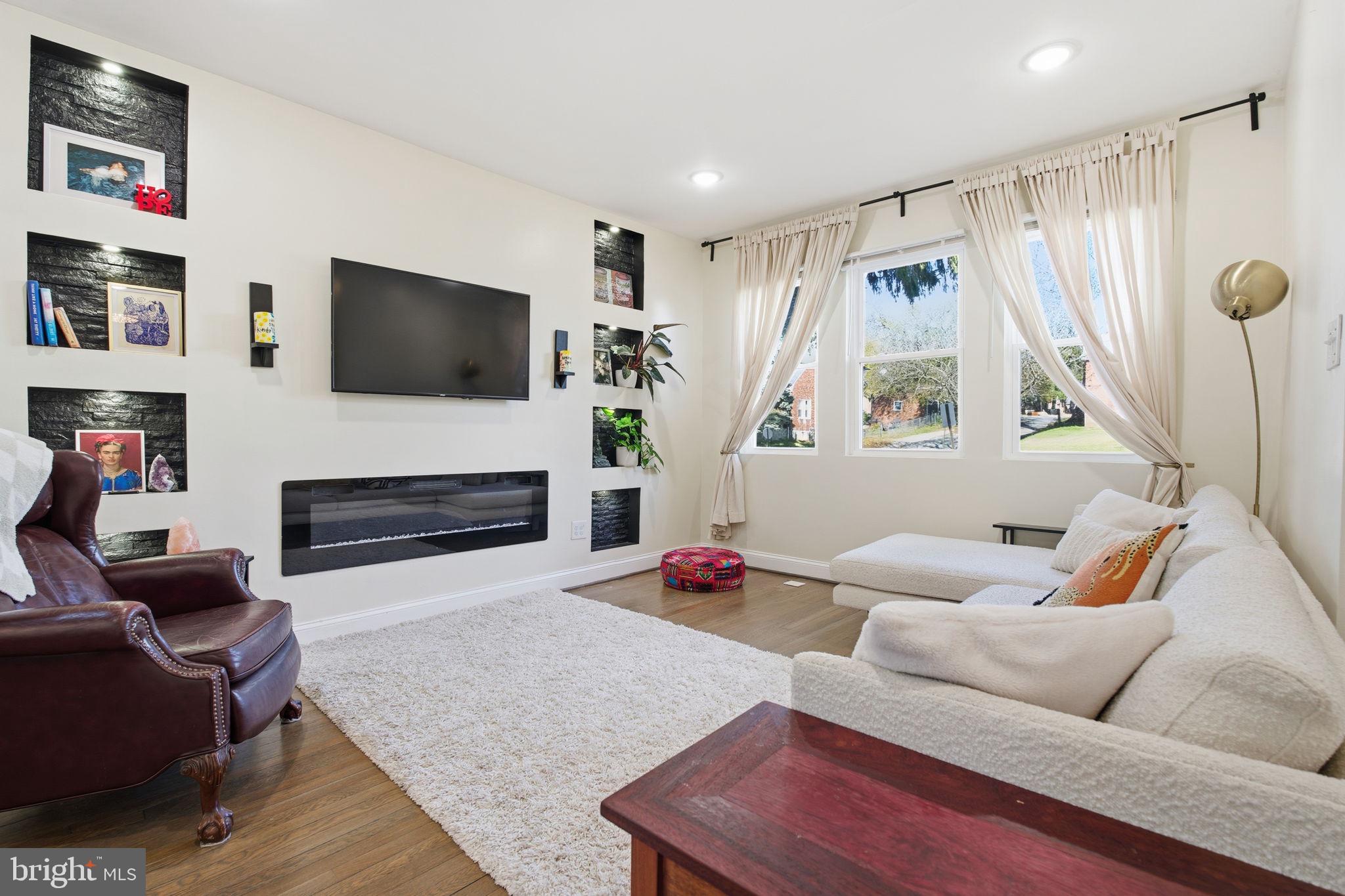 3901 Biddison Lane Baltimore, MD 21206 - Photo 4 of 38 Living room also has electric fireplace