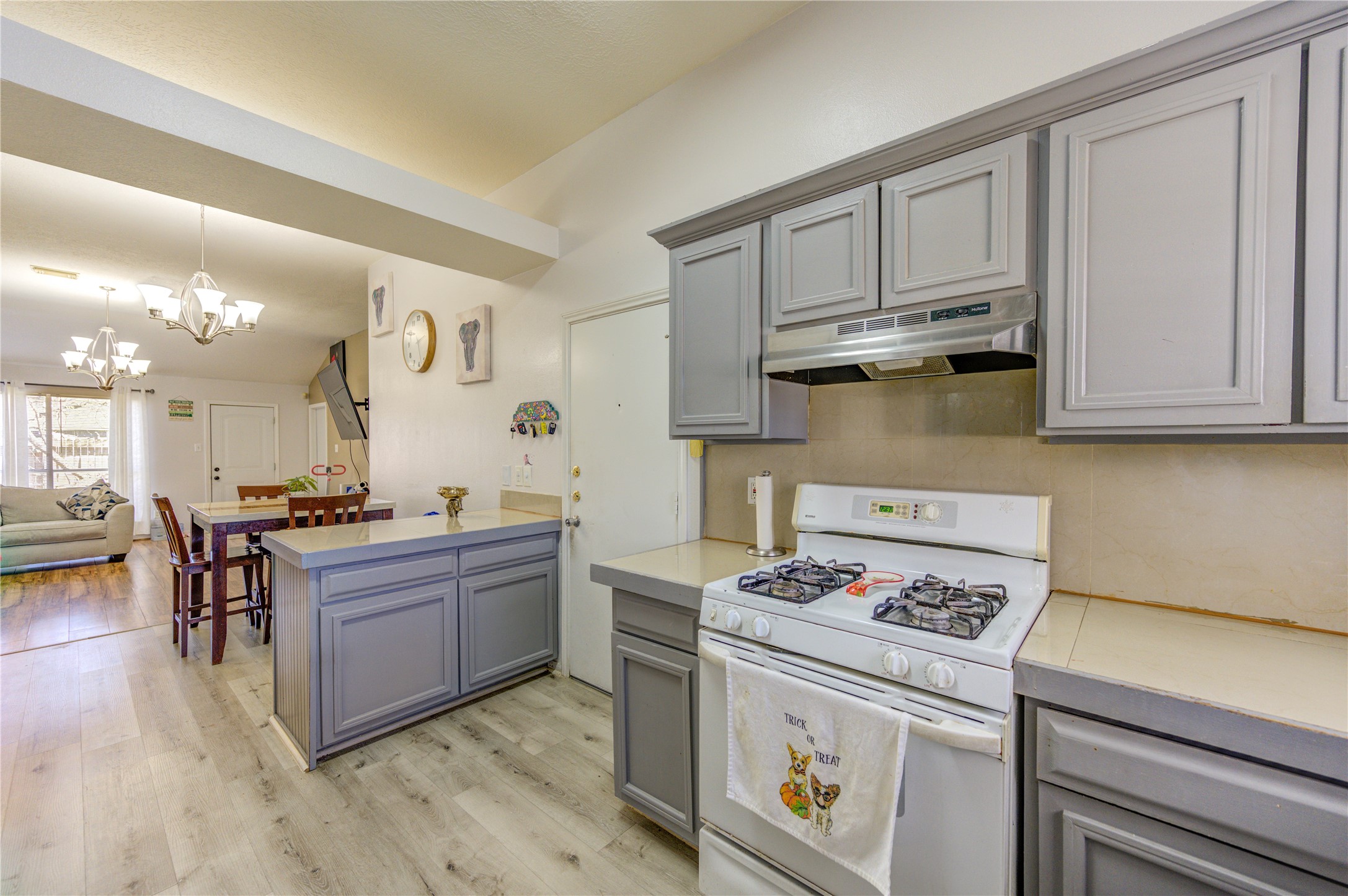 23618 Tree House Lane Spring, TX 77373 - Photo 18 of 46 a kitchen with stainless steel appliances granite countertop a stove and a refrigerator