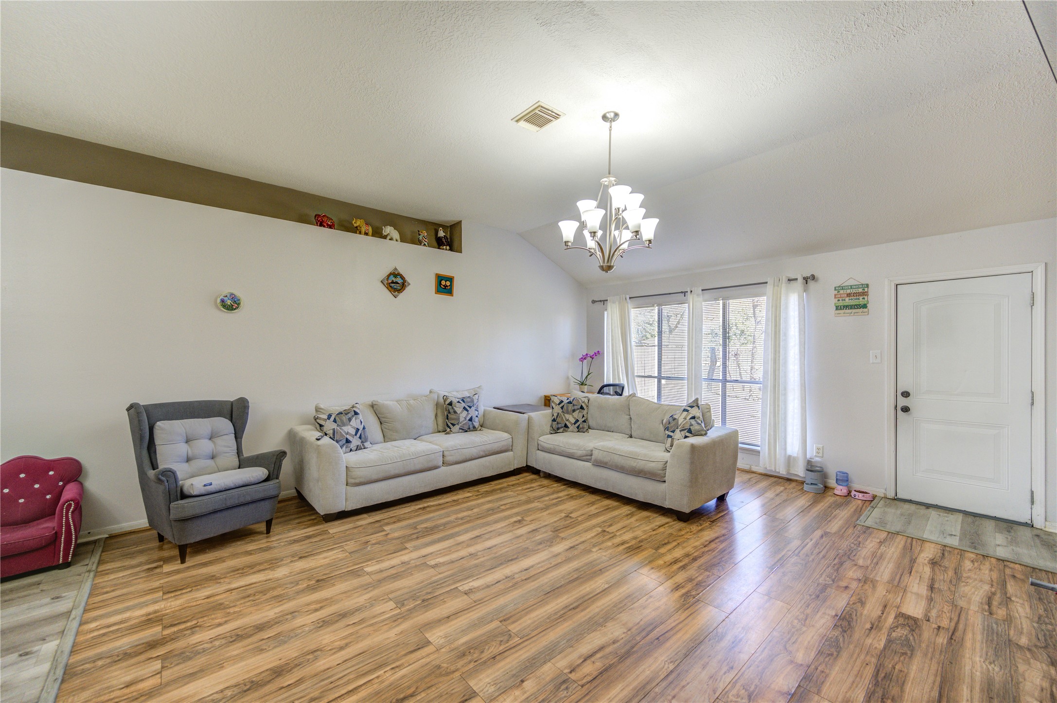 23618 Tree House Lane Spring, TX 77373 - Photo 24 of 46 a living room with furniture and wooden floor