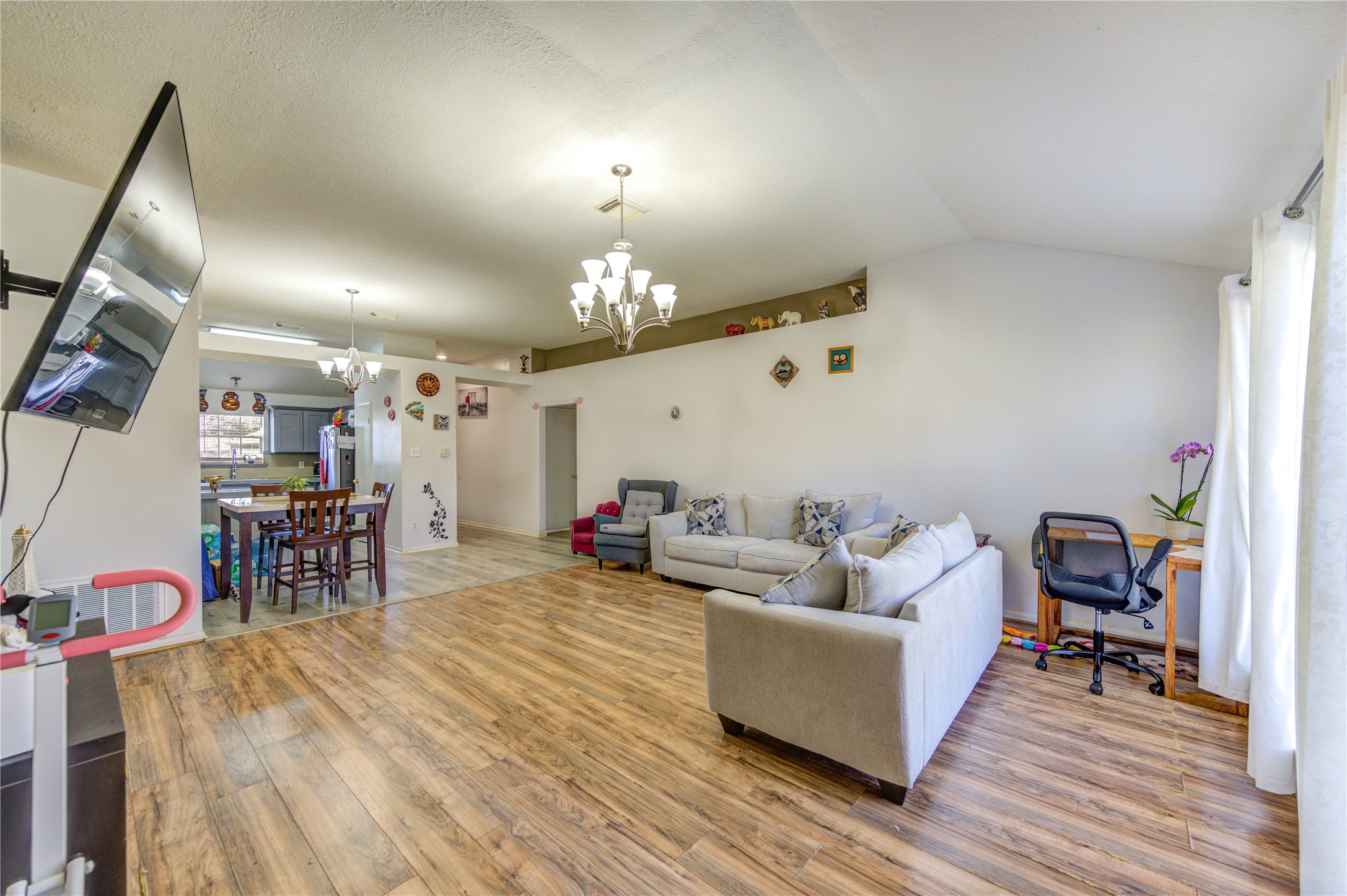 23618 Tree House Lane Spring, TX 77373 - Photo 25 of 46 a living room with furniture and chandelier