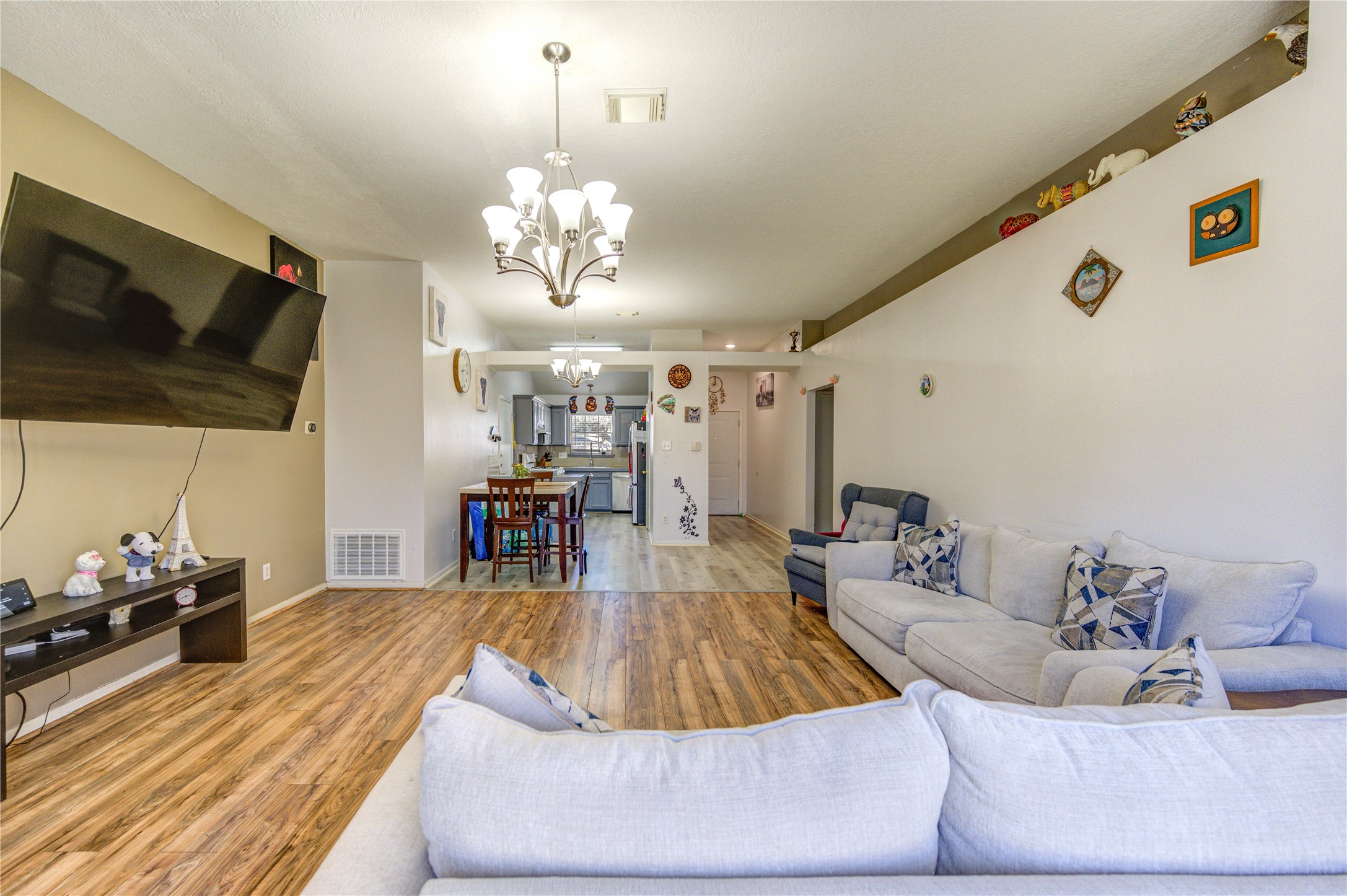 23618 Tree House Lane Spring, TX 77373 - Photo 26 of 46 a living room with furniture and a flat screen tv