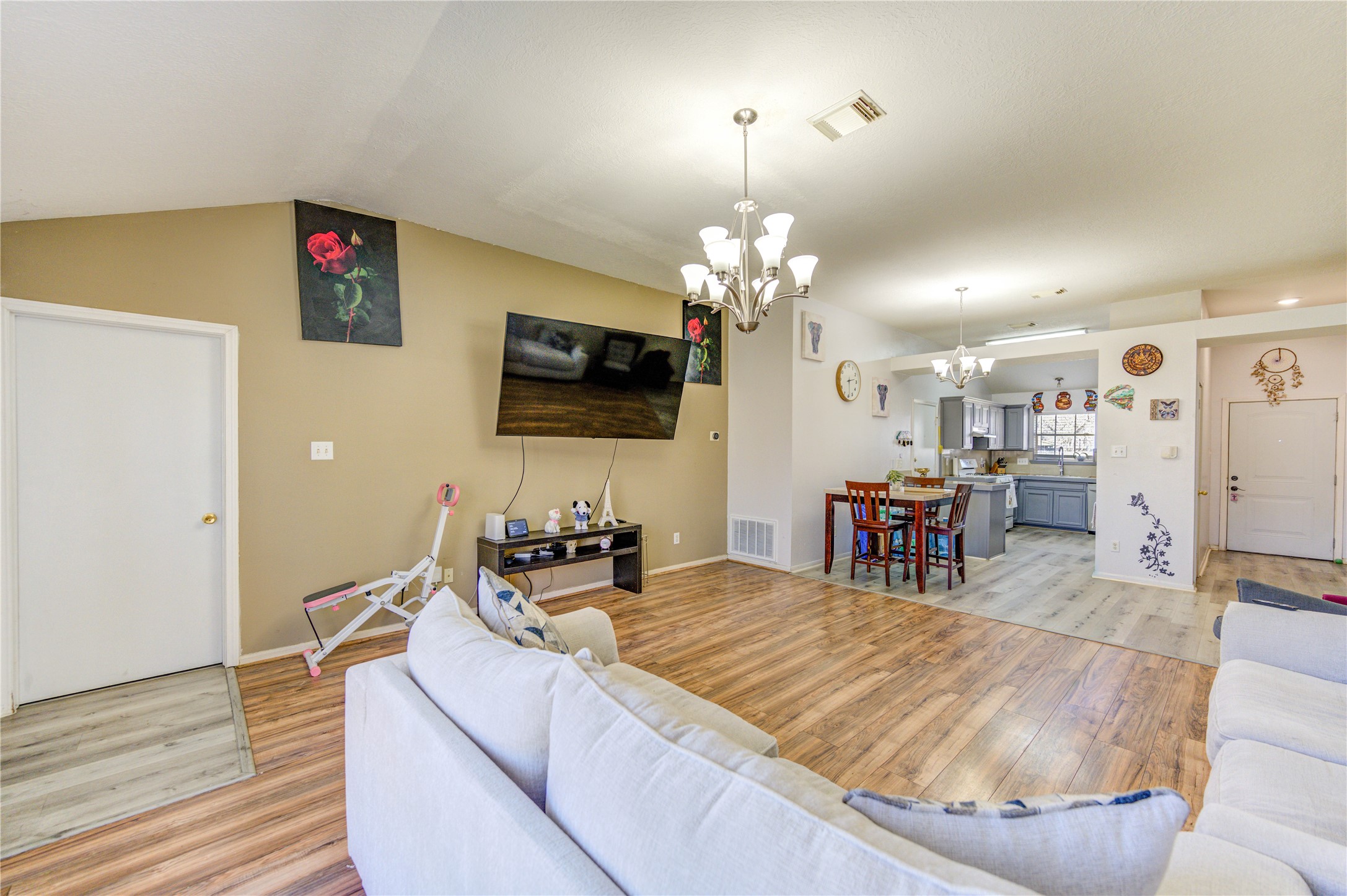 23618 Tree House Lane Spring, TX 77373 - Photo 27 of 46 a living room with furniture and a flat screen tv