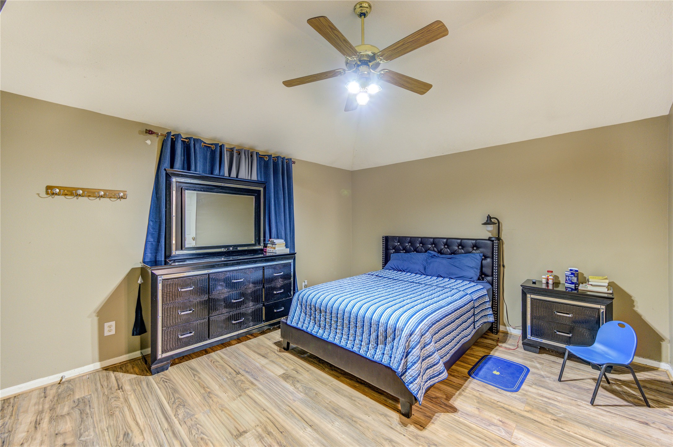 23618 Tree House Lane Spring, TX 77373 - Photo 30 of 46 a bedroom with a bed and a flat screen tv