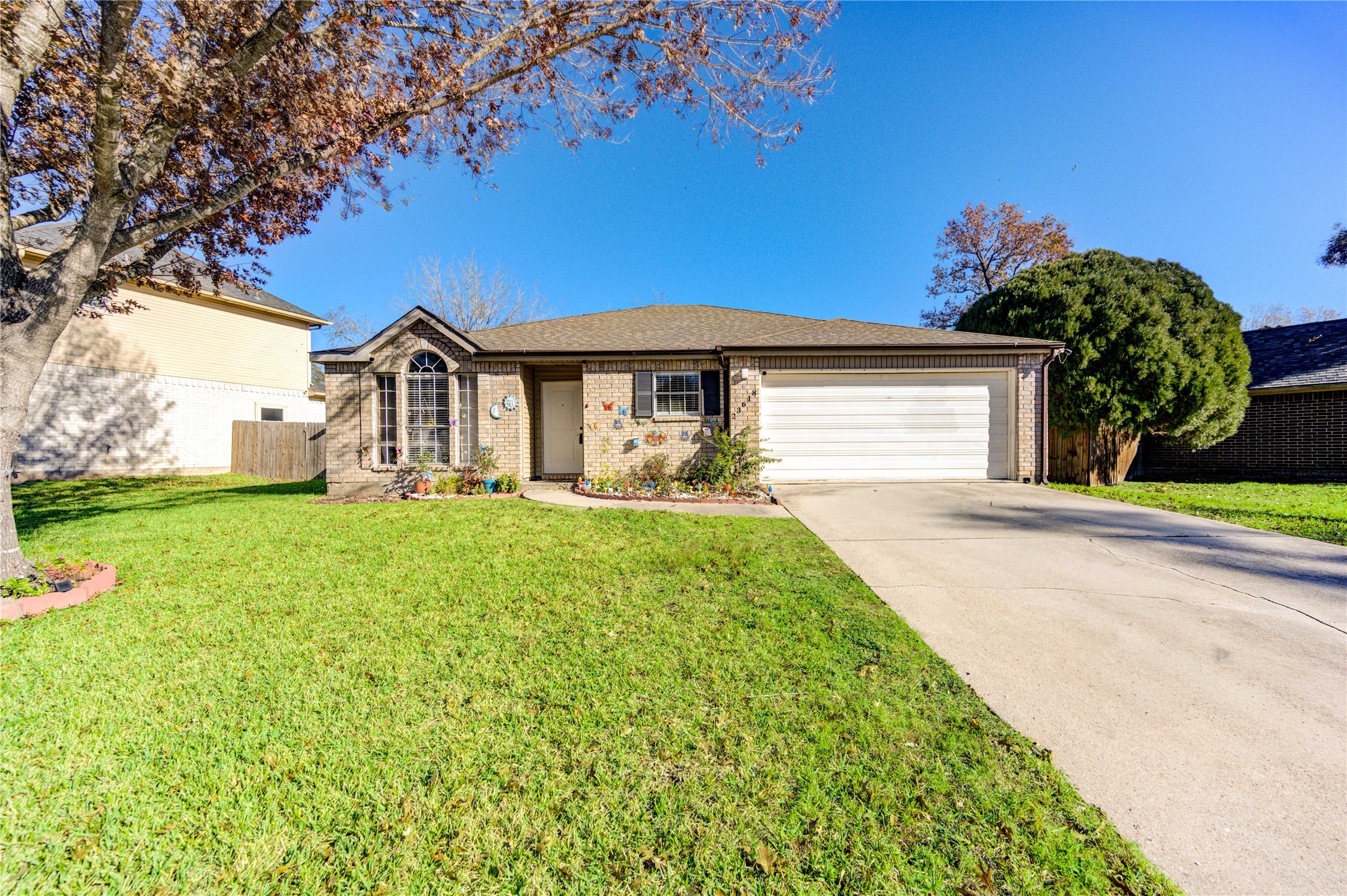 23618 Tree House Lane Spring, TX 77373 - Photo 3 of 46 a front view of a house with a yard and potted plants