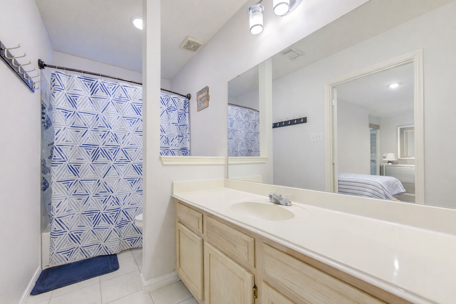 23618 Tree House Lane Spring, TX 77373 - Photo 33 of 46 a bathroom with a sink and a mirror