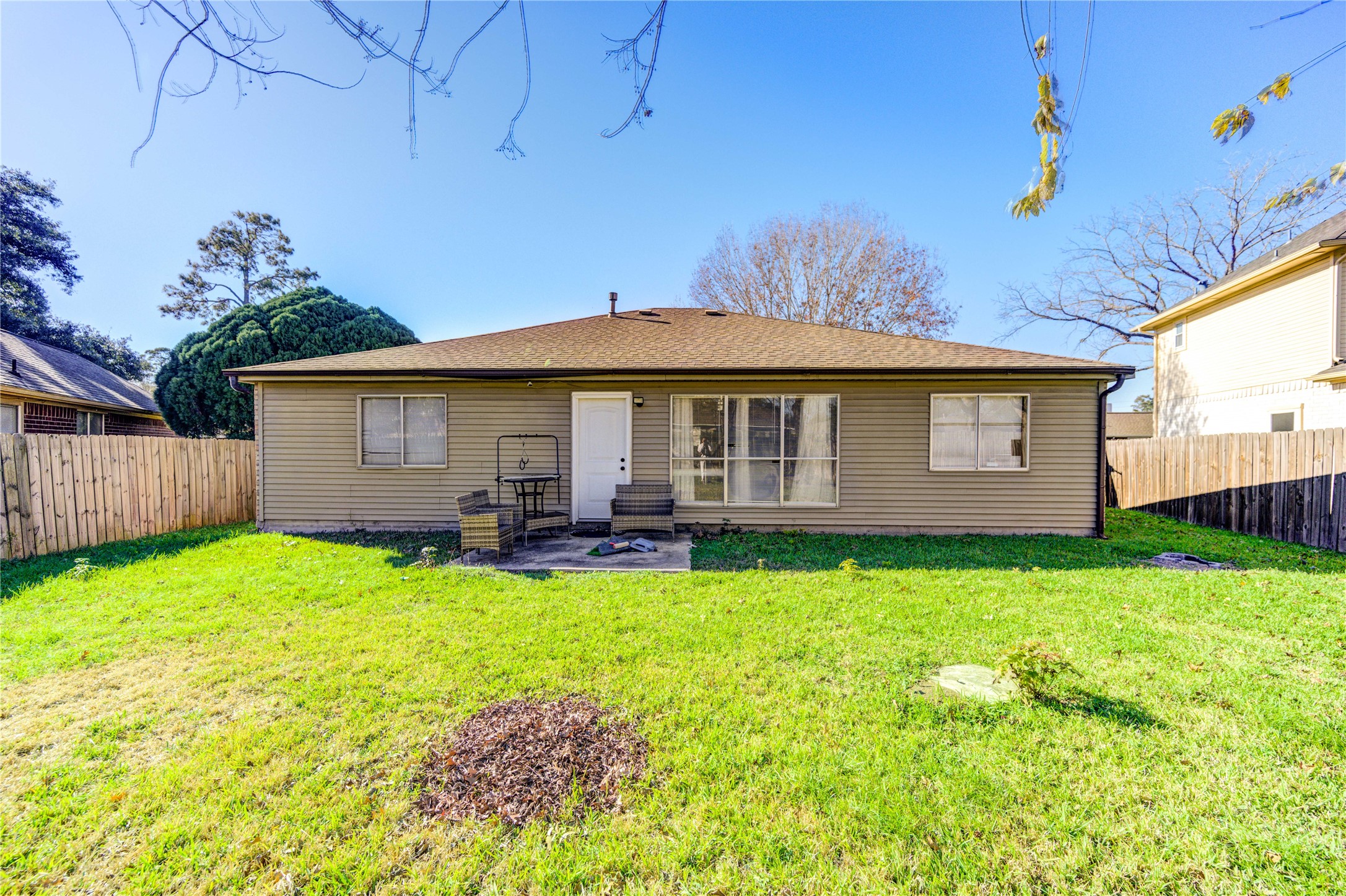 23618 Tree House Lane Spring, TX 77373 - Photo 42 of 46 a view of a house with a yard patio and fire pit