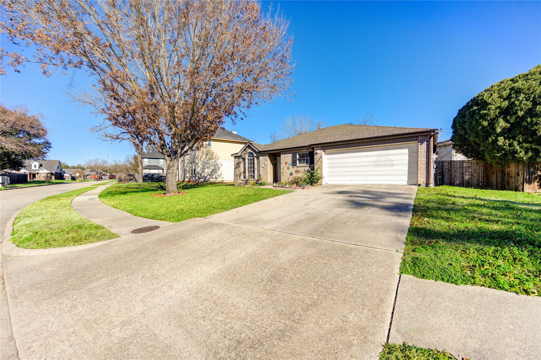 23618 Tree House Lane Spring, TX 77373 - Photo 44 of 46 a backyard of a house with a garden and plants