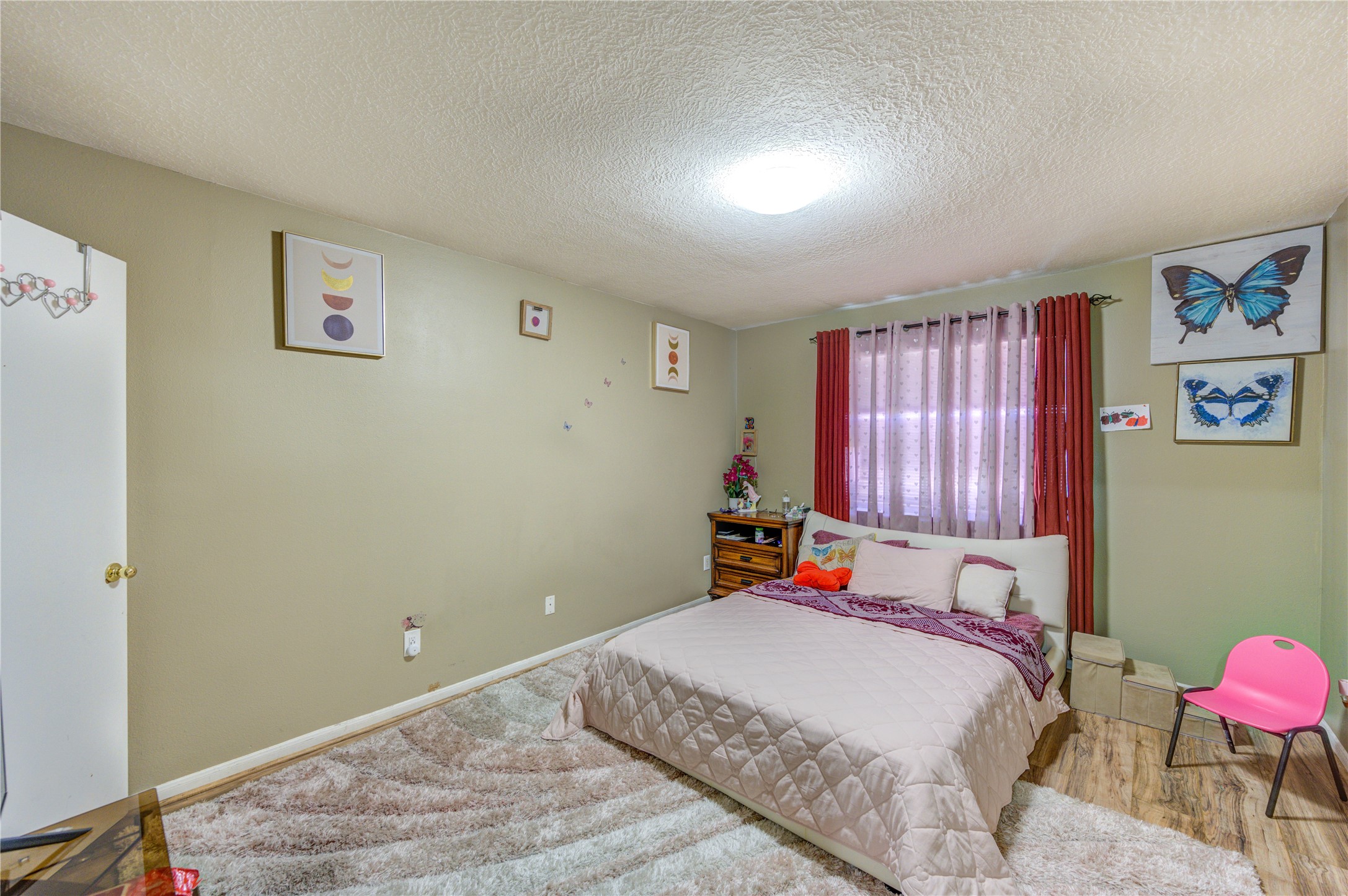 23618 Tree House Lane Spring, TX 77373 - Photo 8 of 46 a bed room with a bed and a window