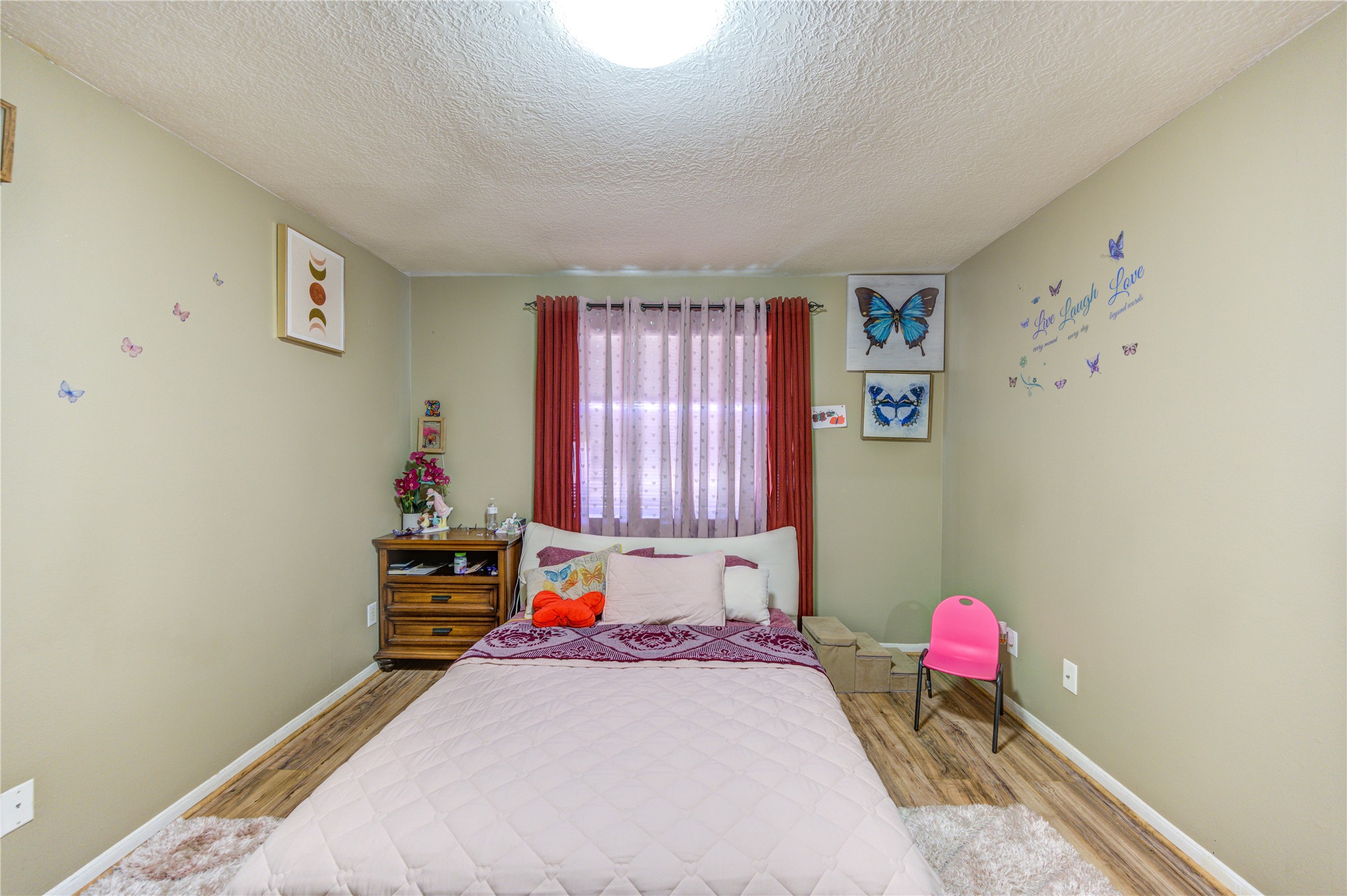 23618 Tree House Lane Spring, TX 77373 - Photo 9 of 46 a bedroom with a bed and a window