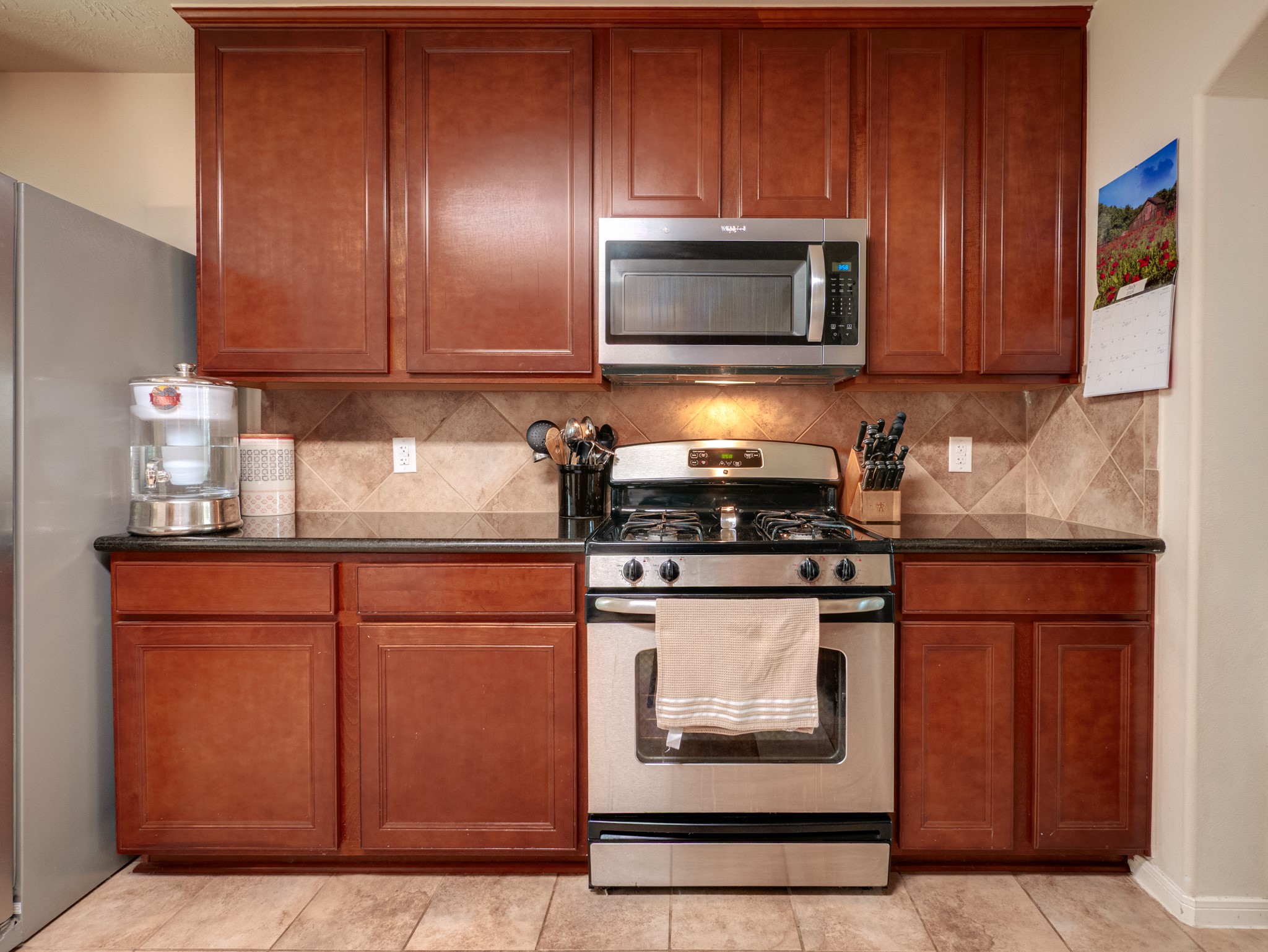 22106 Bridgestone Crossing Drive Spring, TX 77388 - Photo 15 of 26 Stainless gas stove/oven and built in microwave.