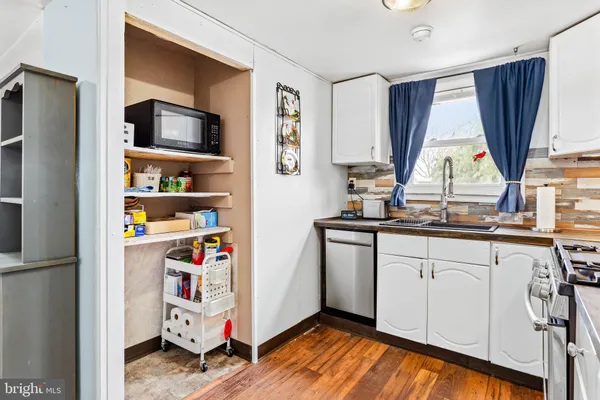 a very nice looking room with a large window and storage