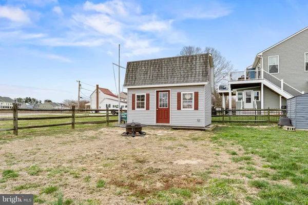 a backyard of a house with yard and barbeque oven
