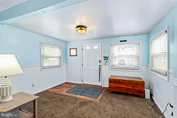 a bedroom with bed and a window