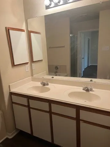 a bathroom with a sink and a mirror