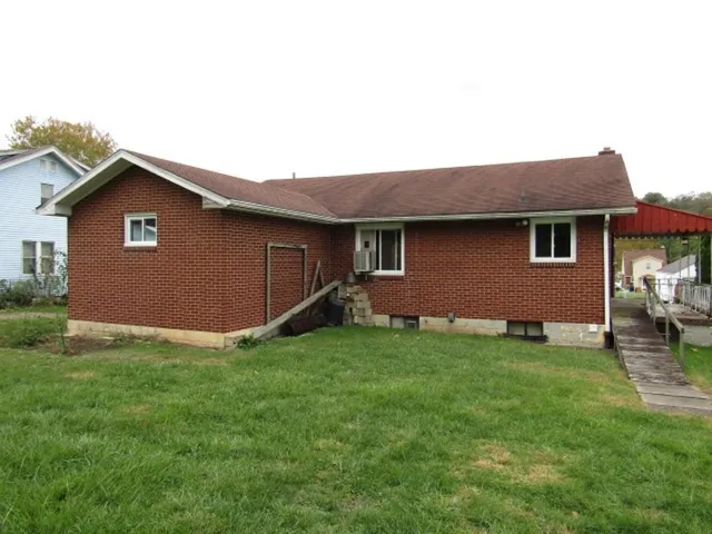 a backyard of a house with seating space
