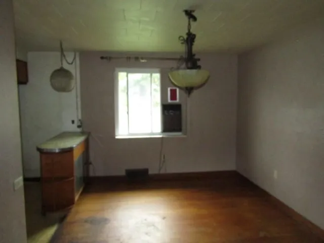 a room with window and a wooden floor