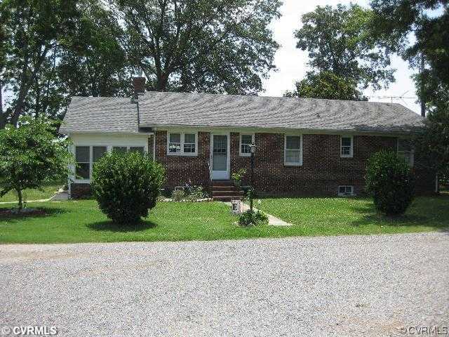 4983 Wakema Road West Point, VA 23181 - Photo 2 of 12 a front view of house with yard and green space