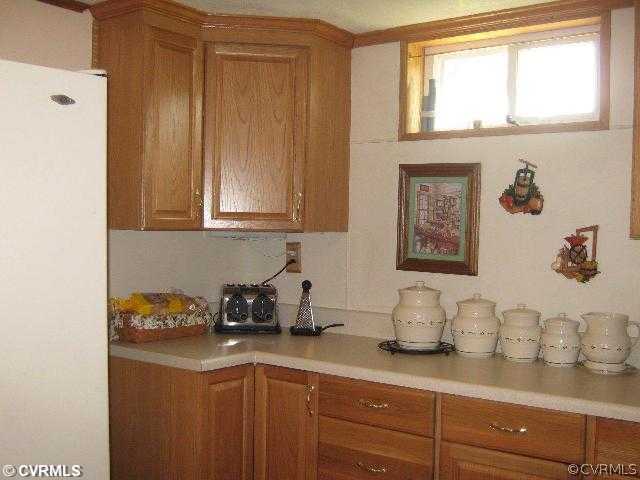4983 Wakema Road West Point, VA 23181 - Photo 5 of 12 a kitchen with a sink cabinets and a window