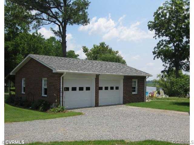 4983 Wakema Road West Point, VA 23181 - Photo 8 of 12 a view of a house with a yard