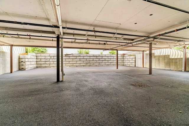 a view of an empty room with glass door