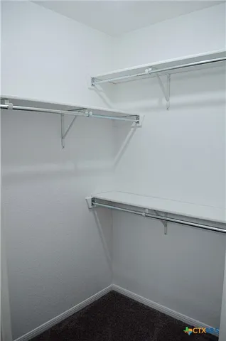 a view of an empty walk in closet