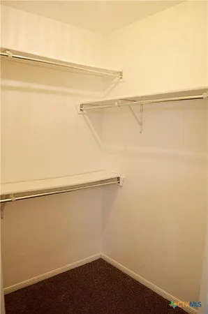 a view of a room with racks on the wall