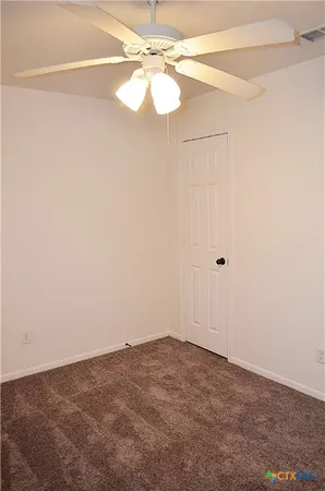 a view of a small space with a fan