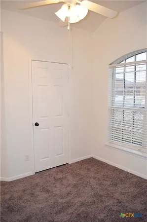 a view of a room that has a window in it